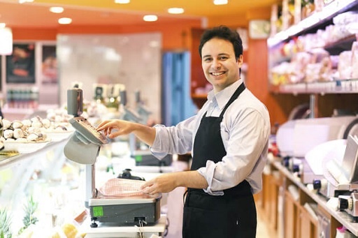 Employee attending customer in a supermarket